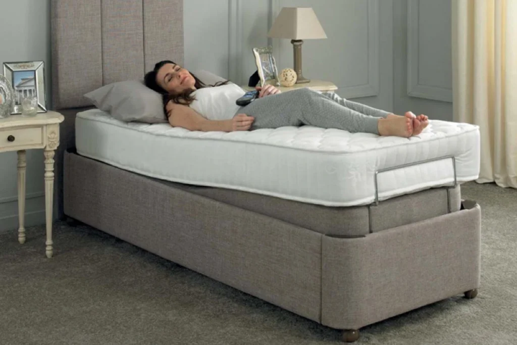 Woman lying on an adjustable bed base.